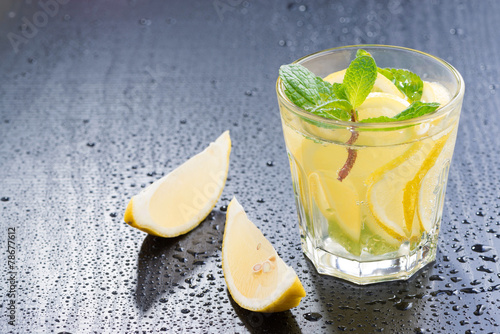 Fresh lemonade with mint on a dark background