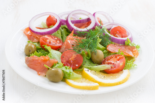 fresh salad with salted salmon, close-up