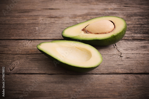 Ripe avocado on a wooden background