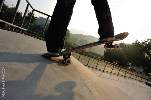 skateboarder skateboarding at skatepark
