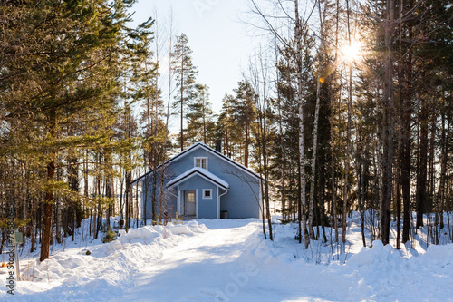 House in winter forest