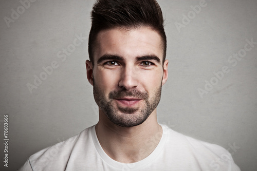 Portrait of young handsome man with bristle