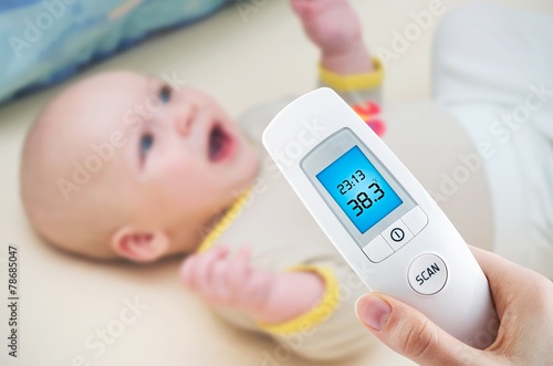 Measuring temperature to a baby with digital thermometer