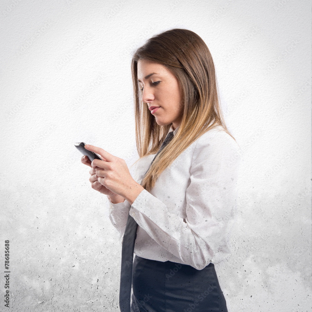 Young businessmen with his mobile over isolated background. Young businessmen with his mobile over isolated background.