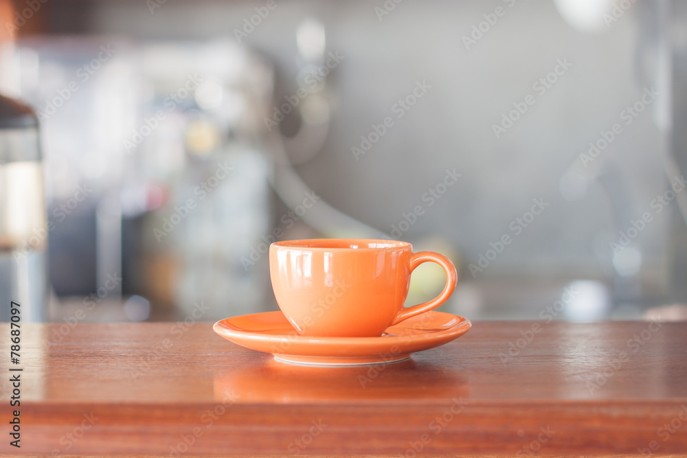 Mini oange coffee cup in coffee shop Mini oange coffee cup in coffee shop