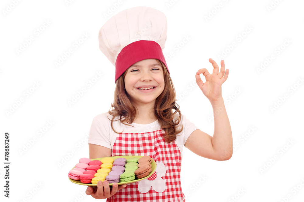 happy little girl cook with sweet macarons and ok hand sign happy little girl cook with sweet macarons and ok hand sign
