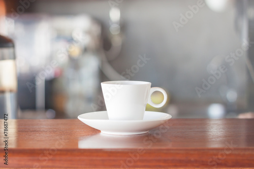 Mini white coffee cup in coffee shop
