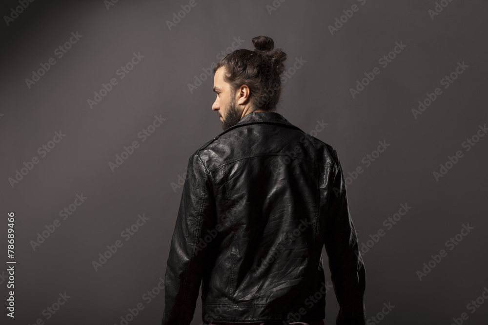 back view of man with beard and bun black leather jacket Stock Photo | Adobe Stock