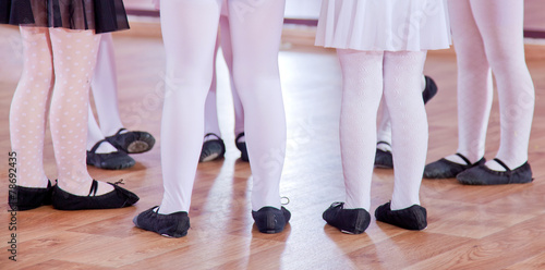 Ballet dancers children in class, legs only photo