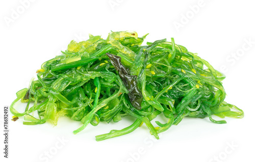 A portion of fresh wakame seaweed on a white background