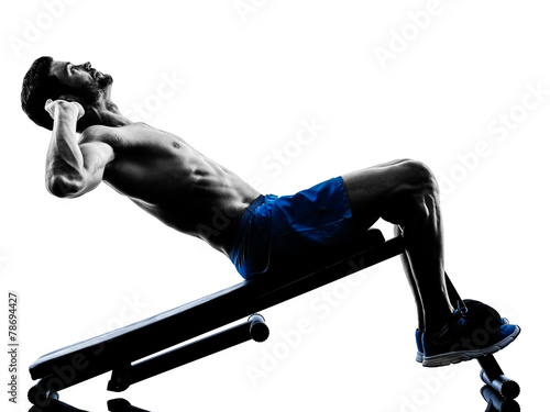 Fototapeta man exercising fitness crunches Bench Press exercises silhouette