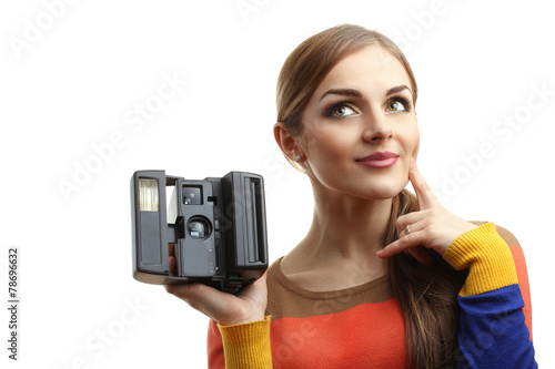 beautiful girl with old retro camera in hand isolated