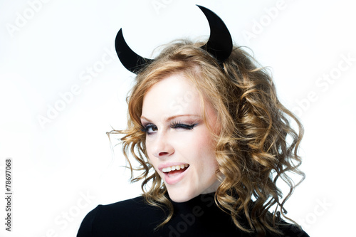 Obraz na plátně The beautiful young girl a devil