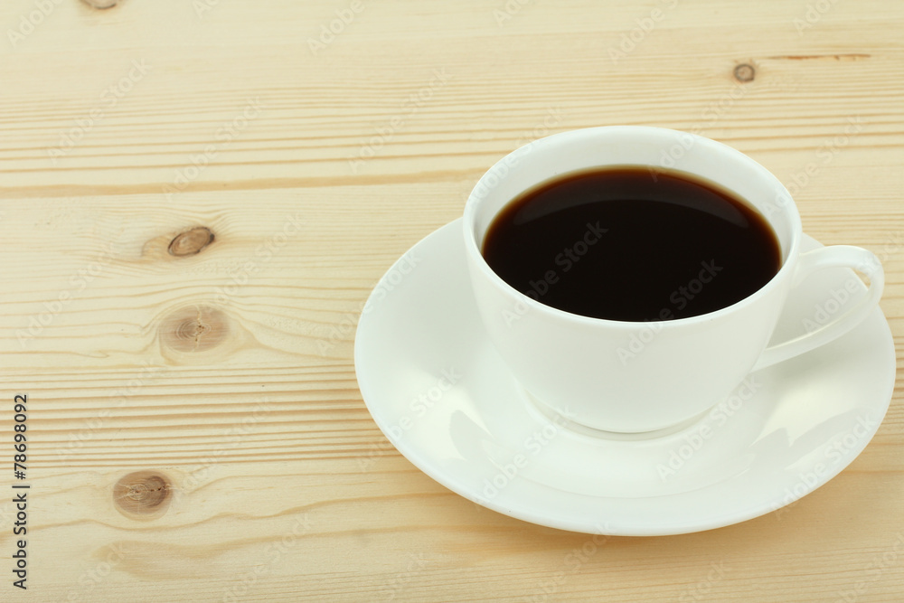Cup of coffee on old white wooden table.