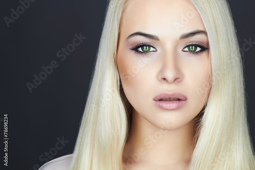 Young Beautiful blond woman.Beauty Girl.green cat eyes.make-up