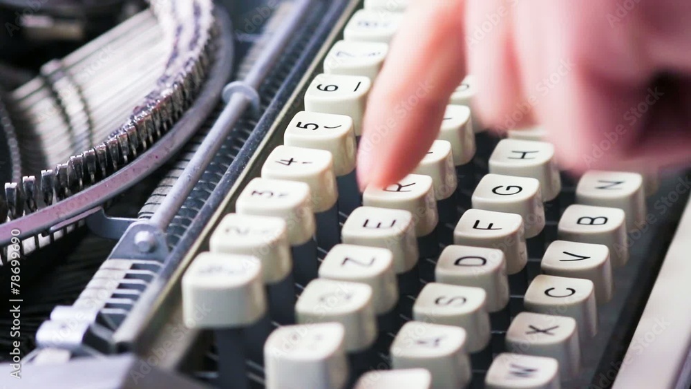 typewriter typing. Vintage typewriter being used by male hands Stock