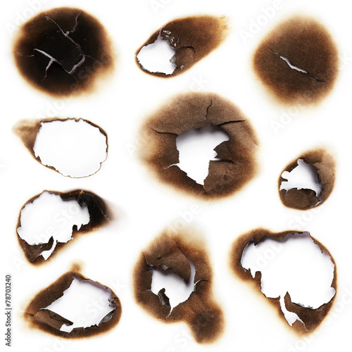 Burnt holes of paper photo