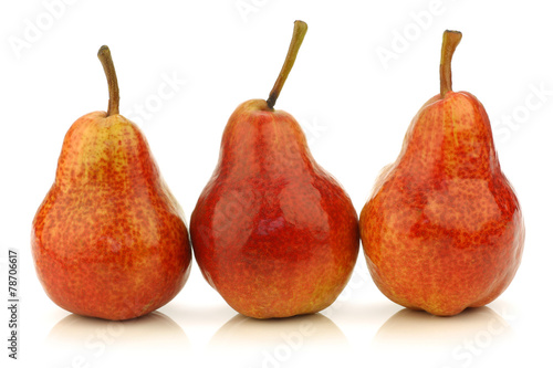 Row of fresh Bartlett Pears on a white background