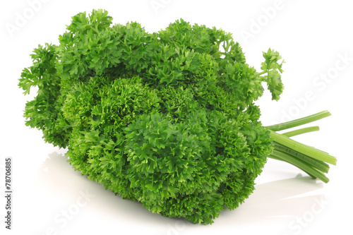 Bundle of fresh parsley on a white background