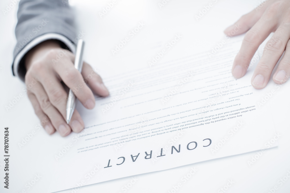 Business man signing a contract Business man signing a contract