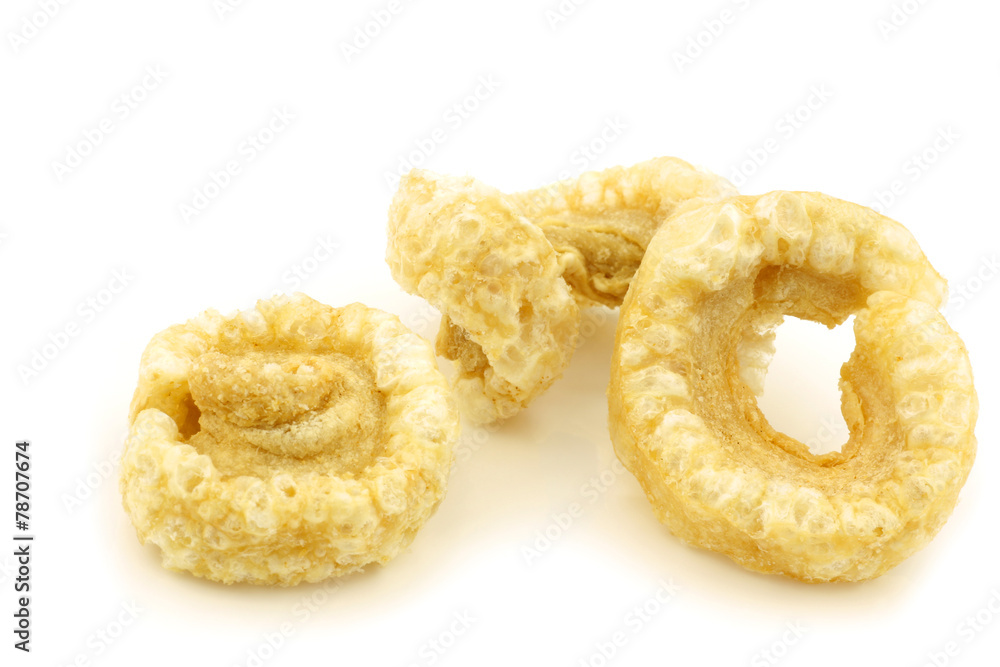 crispy fried bacon snacks on a white background crispy fried bacon snacks on a white background