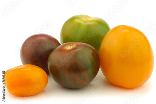  little colorful snack tomatoes on a white background