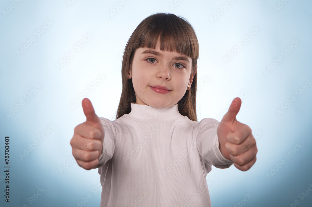 The young girl with the index finger down or up isolated The young girl with the index finger down or up isolated