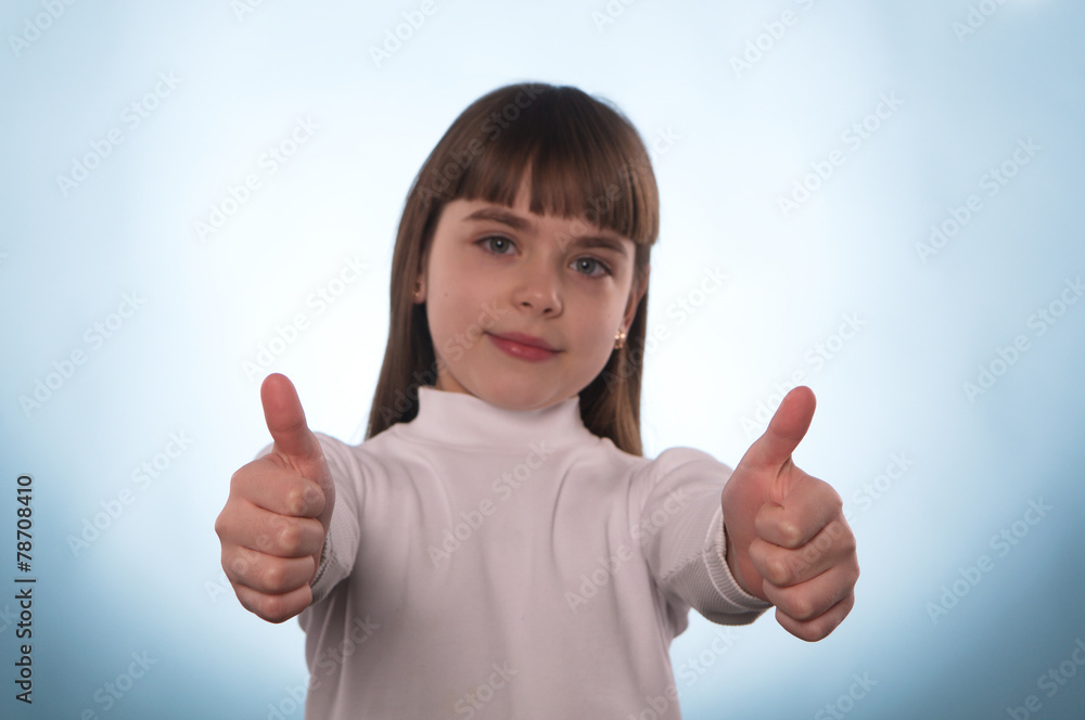 The young girl with the index finger down or up isolated The young girl with the index finger down or up isolated