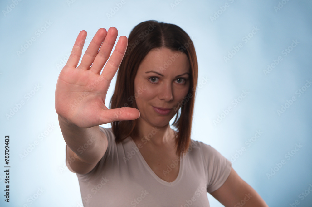 The woman with short hair holding a hand in protest The woman with short hair holding a hand in protest