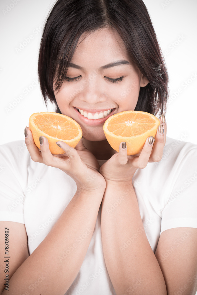 Young woman holding fresh oranges. Healthy eating. Isolated over Young woman holding fresh oranges. Healthy eating. Isolated over