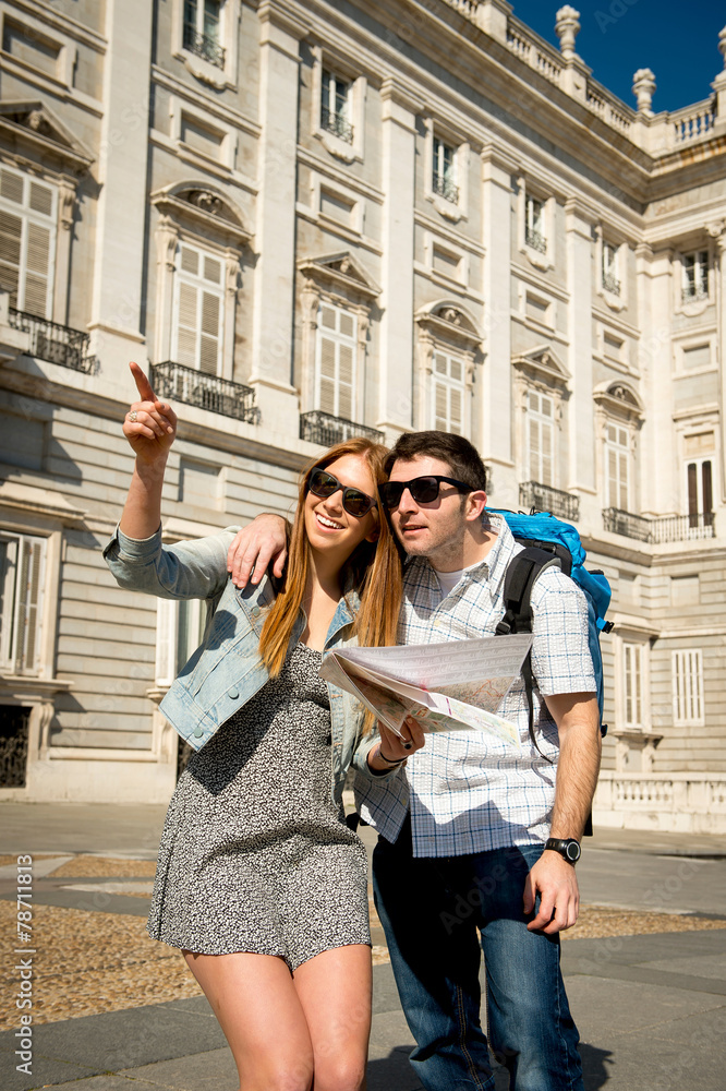 friends tourist couple visiting Madrid in holidays with city map