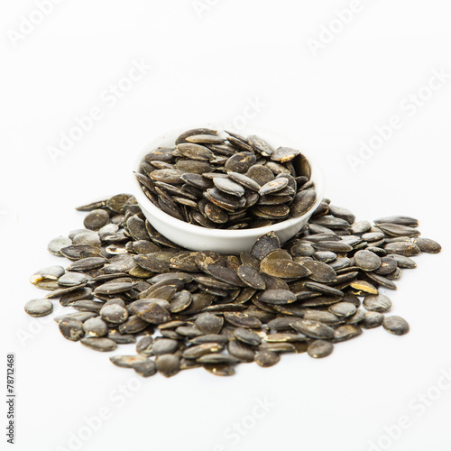 pumpkin seeds isolated on white background. Fresh roasted Pumpki