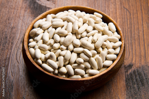 cannellini beans on wood bowl