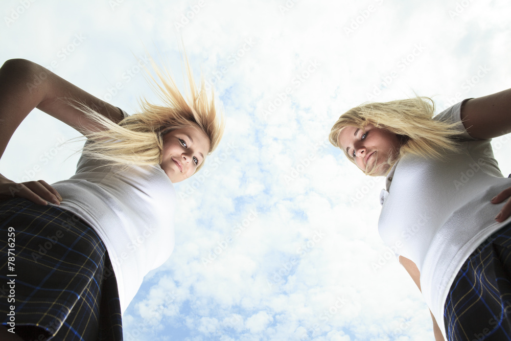 Two beautiful blond young women teen girl friends having fun Two beautiful blond young women teen girl friends having fun