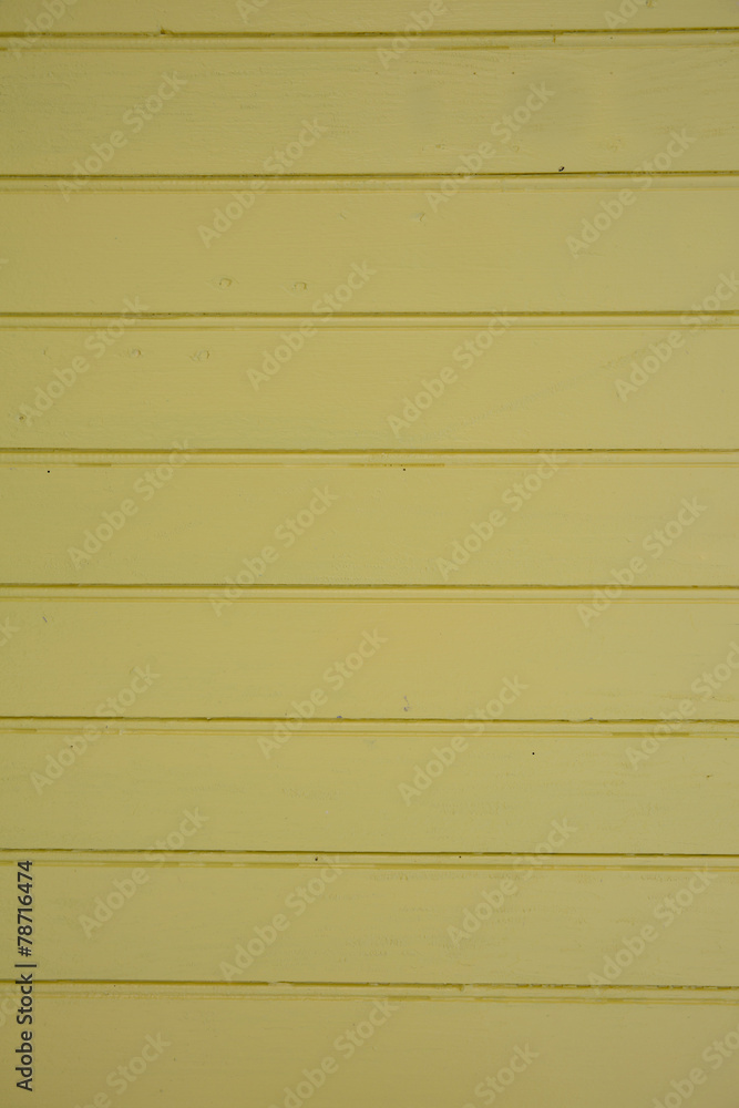 Wooden wall background is painted in yellow paint Wooden wall background is painted in yellow paint