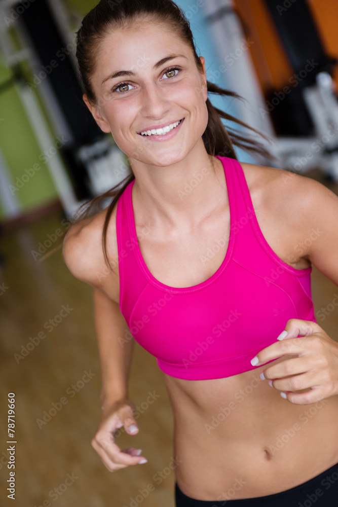 woman exercising on treadmill in gym woman exercising on treadmill in gym