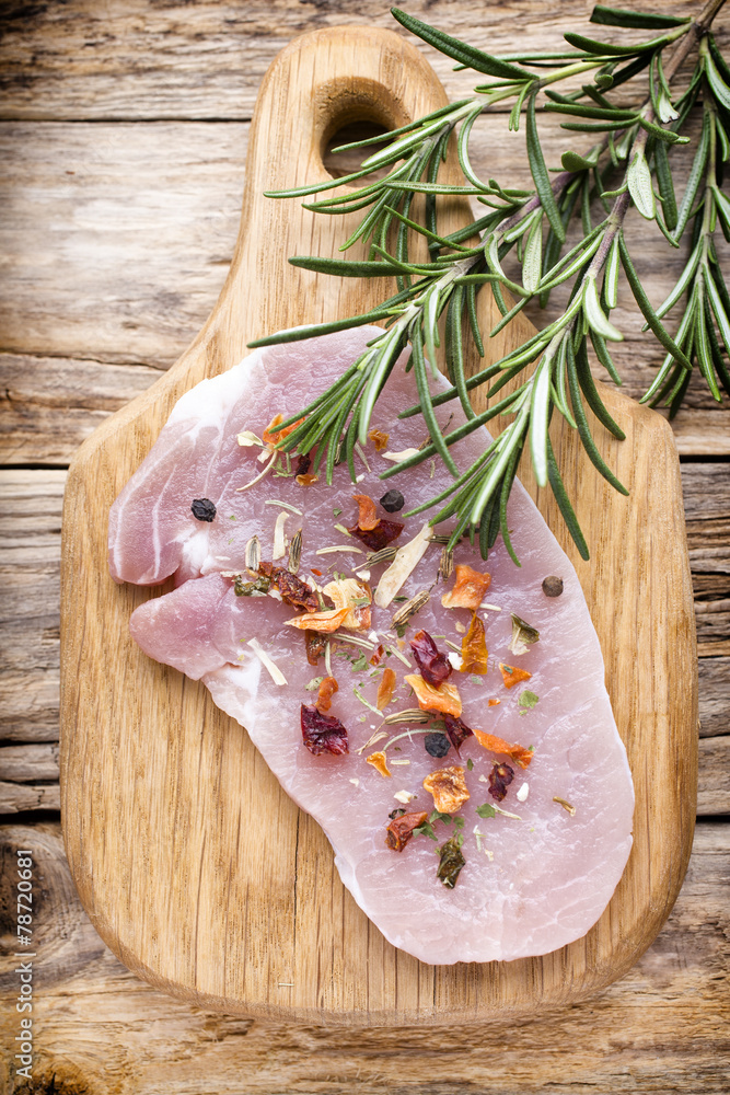 Pork chop, meat slices on a wood background. Pork chop, meat slices on a wood background.