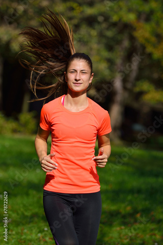 Running woman. Female runner jogging during outdoor workout