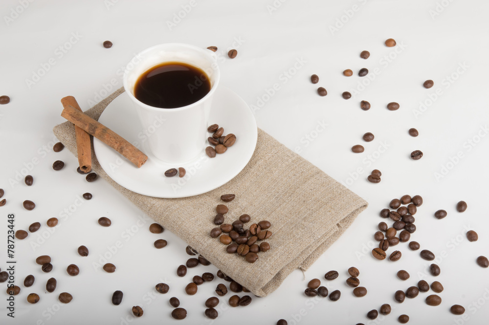 Fototapeta premium Coffee cup and beans on a white background.
