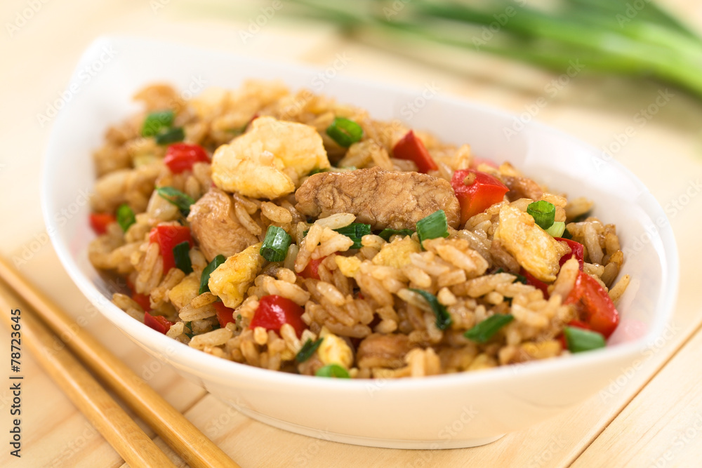 Chinese fried rice with vegetables, chicken and fried egg Chinese fried rice with vegetables, chicken and fried egg