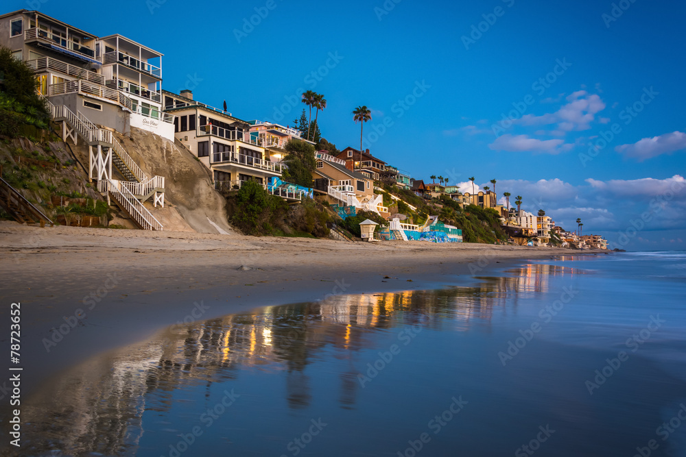 Beachfront homes at twilight, in Laguna Beach, California.