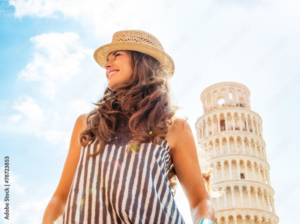 Portrait of happy young woman in Pisa