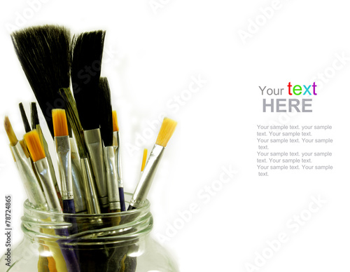 Brushes in glass jar