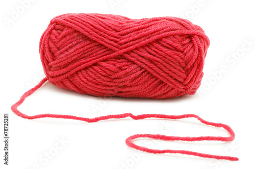 Red knitting yarn isolated on white