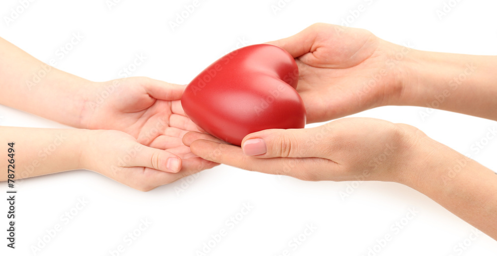 Heart in child and mother hands isolated on white Heart in child and mother hands isolated on white