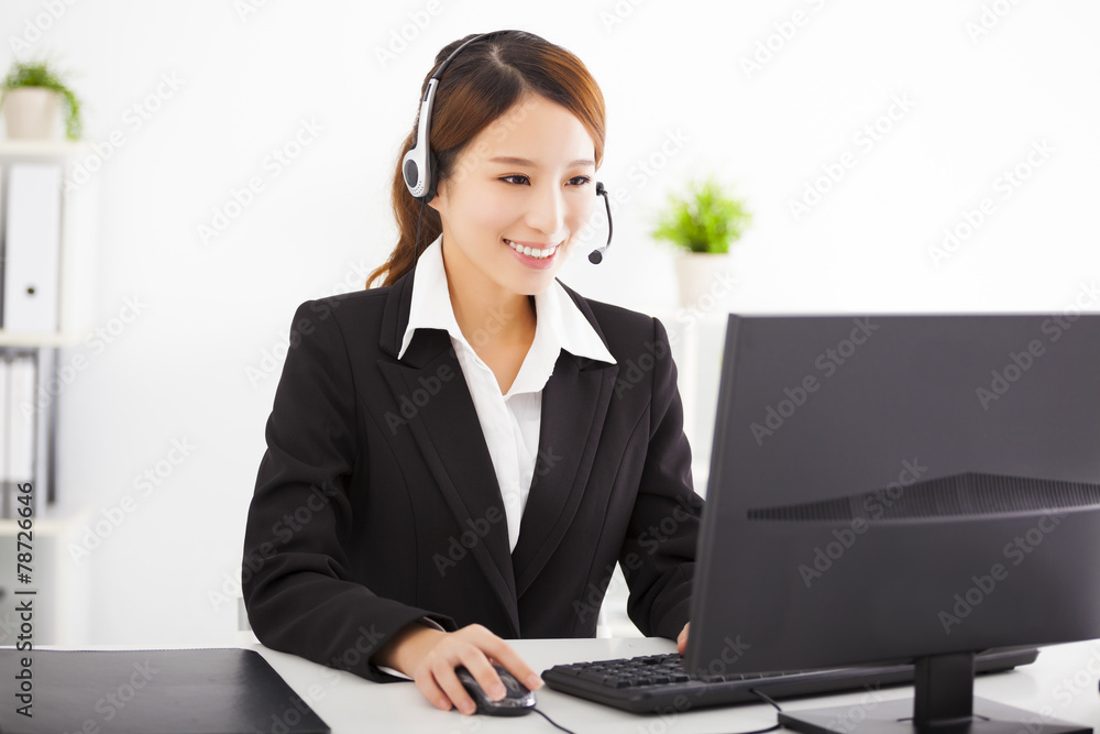 young beautiful asian businesswoman with headset in office young beautiful asian businesswoman with headset in office