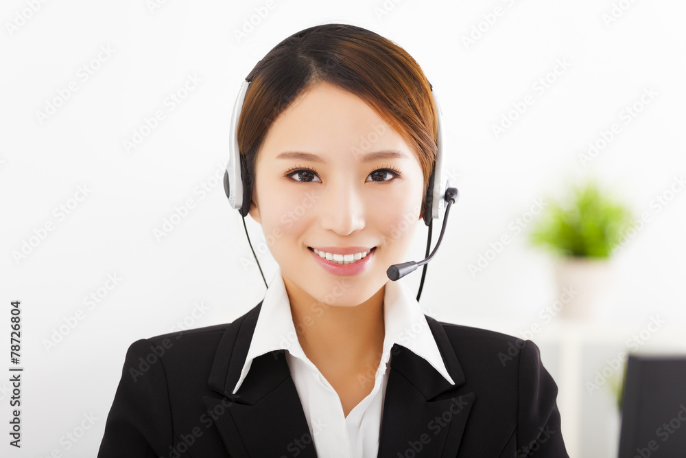 young beautiful businesswoman with headset in office young beautiful businesswoman with headset in office