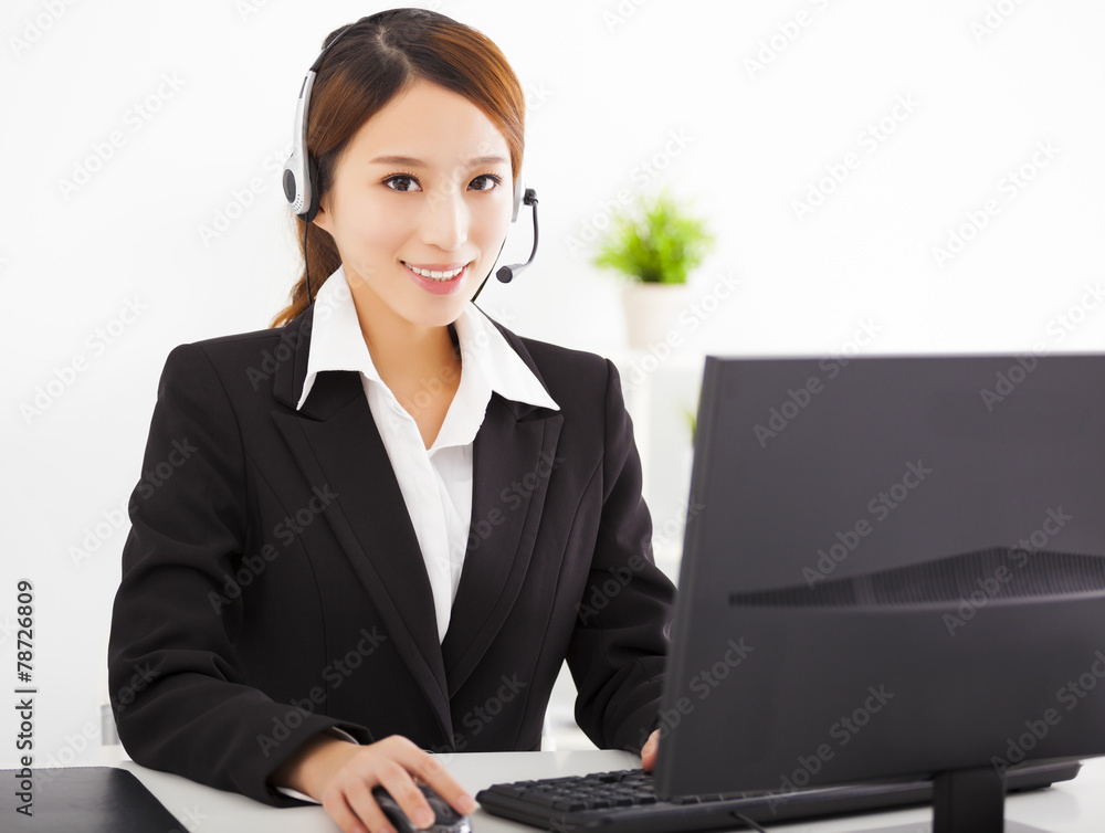 young beautiful asian businesswoman with headset in office young beautiful asian businesswoman with headset in office