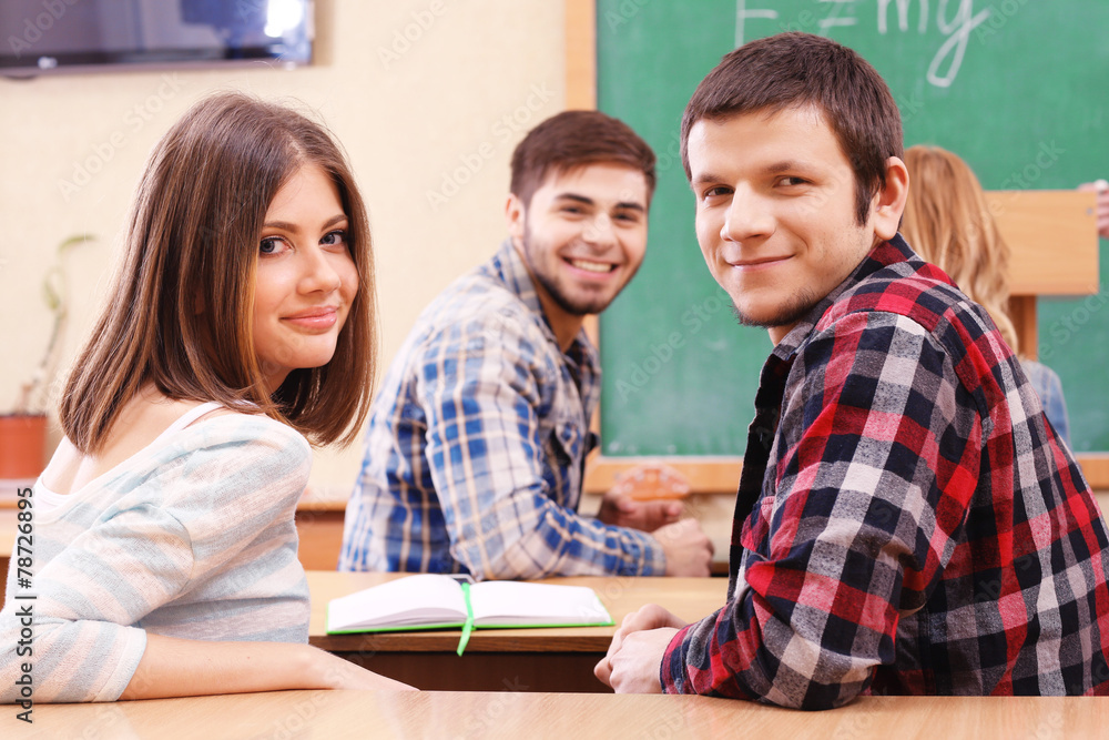 Group of students sitting in classroom Group of students sitting in classroom