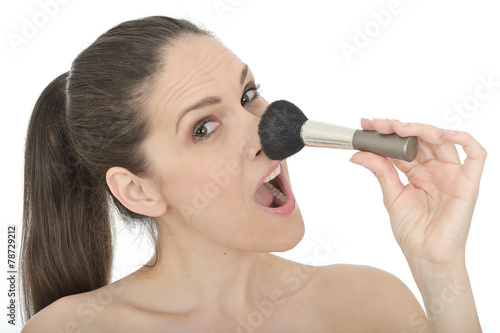 Attractice Young Woman Applying Face Powder